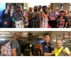 Manchester Tank Quincy holds Backpack Give Away
